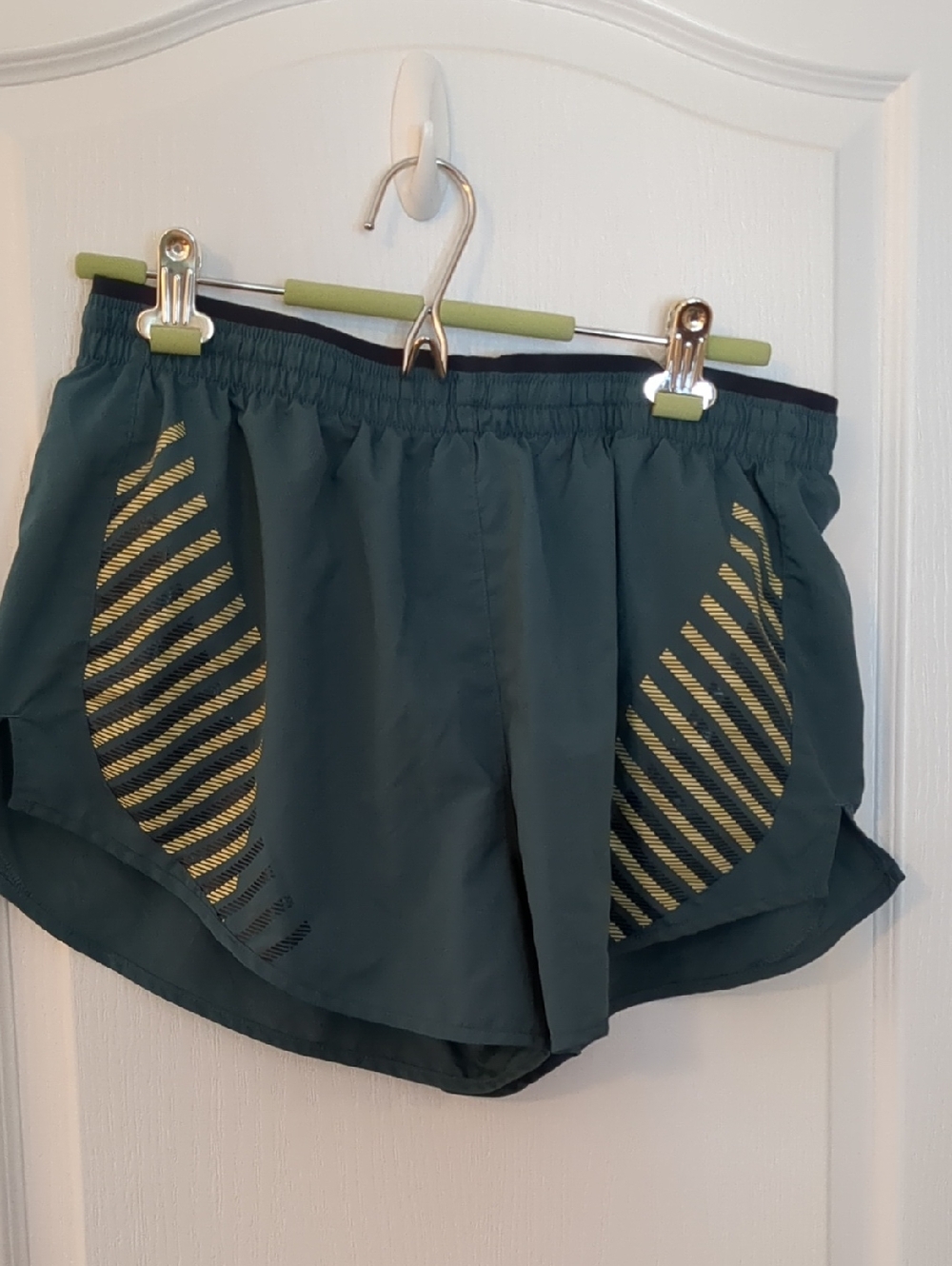 Nike Women’s Teal Athletic Shorts with Yellow Stripes
